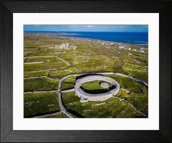 Framed Print : Dún Eochla. Stone for with old lighthouse in the background. Inishmore, Aran island, Ireland Framed Print : Dún Eochla. Stone for with old lighthouse in the background. Inishmore, Aran island, Ireland