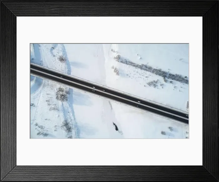Framed Print : Cars move on bridge road in winter time aerial above drone view Framed Print : Cars move on bridge road in winter time aerial above drone view