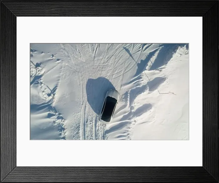 Framed Print : One car parked at snow field above top view fron drone. Travel on car theme Framed Print : One car parked at snow field above top view fron drone. Travel on car theme