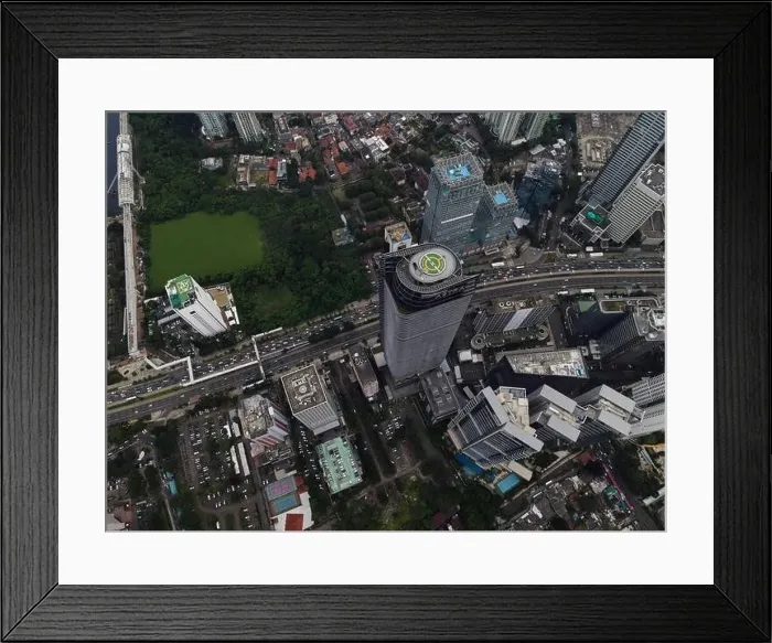 Framed Print : Aerial view of highway intersection and buildings in the city of Jakarta and noise cloud with Jakarta cityscape Framed Print : Aerial view of highway intersection and buildings in the city of Jakarta and noise cloud with Jakarta cityscape