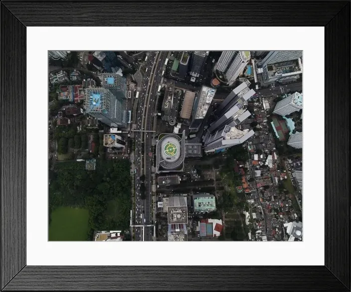 Framed Print : Aerial view of highway intersection and buildings in the city of Jakarta and noise cloud with Jakarta cityscape Framed Print : Aerial view of highway intersection and buildings in the city of Jakarta and noise cloud with Jakarta cityscape