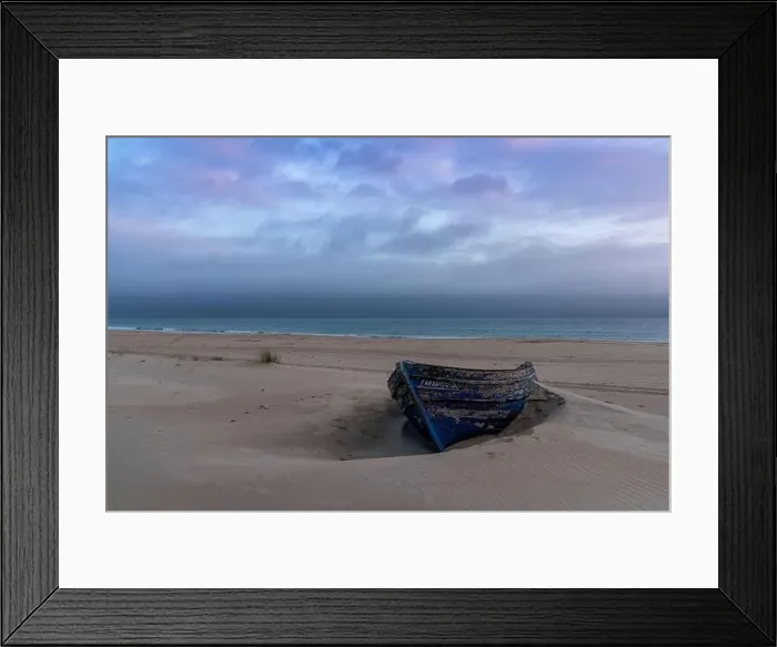 Framed Print : colorful wreck of an old wooden rowboat buried in the sand with a beautiful sunset sky and ocean behind Framed Print : colorful wreck of an old wooden rowboat buried in the sand with a beautiful sunset sky and ocean behind