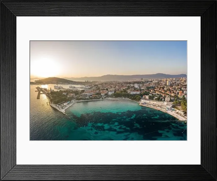 Framed Print : Split, Croatia - Aug 13, 2020: Aerial drone shot of Bavice city beach during sunset hour in summer Framed Print : Split, Croatia - Aug 13, 2020: Aerial drone shot of Bavice city beach during sunset hour in summer