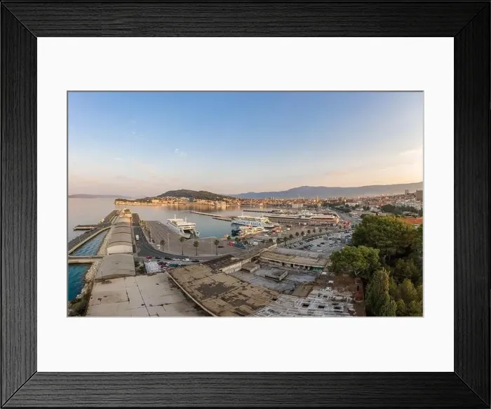Framed Print : Split, Croatia - Aug 14, 2020: Aerial drone shot of ferry port at old town port in sunrise hour