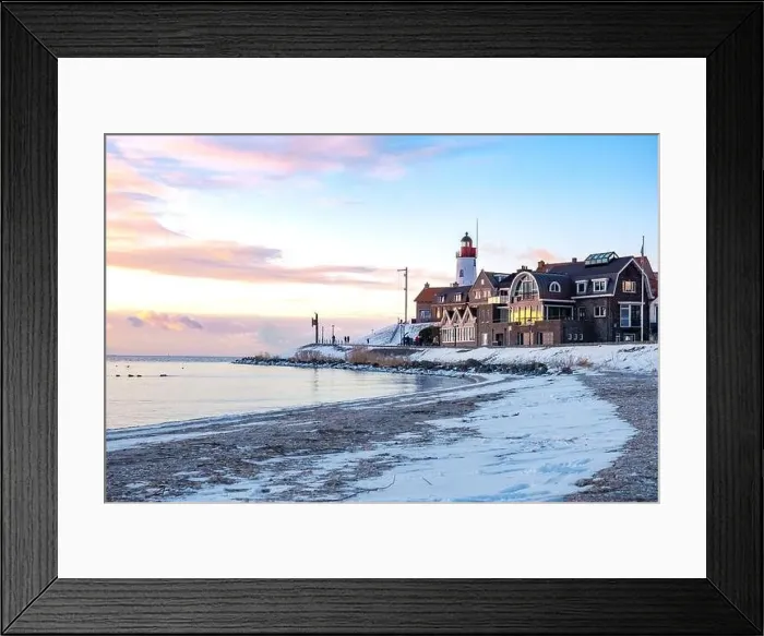 Framed Print : Urk Netherlands lighthouse during winter with snow covered coastline