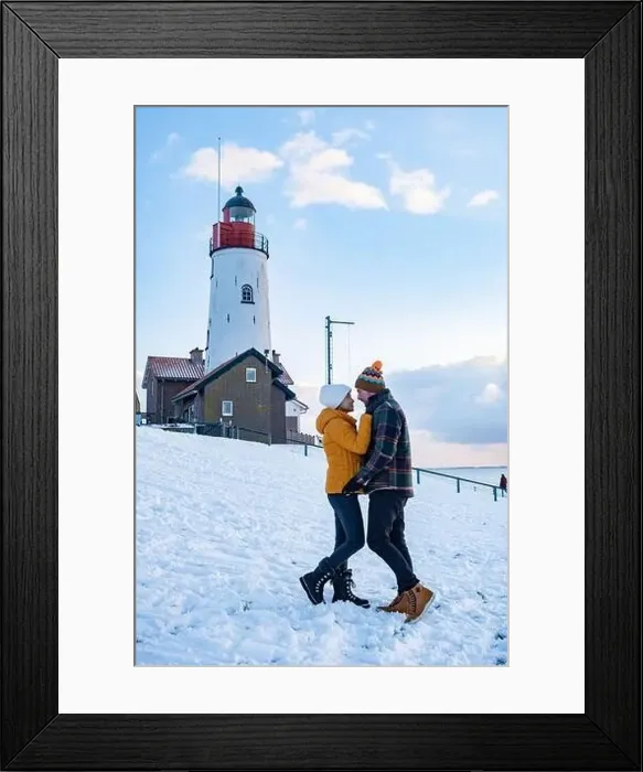 Framed Print : Urk Netherlands lighthouse during winter with snow covered coastline Framed Print : Urk Netherlands lighthouse during winter with snow covered coastline