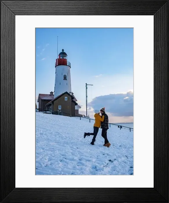 Framed Print : Urk Netherlands lighthouse during winter with snow covered coastline Framed Print : Urk Netherlands lighthouse during winter with snow covered coastline