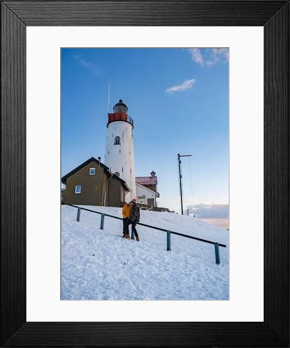Framed Print : Urk Netherlands lighthouse during winter with snow covered coastline Framed Print : Urk Netherlands lighthouse during winter with snow covered coastline