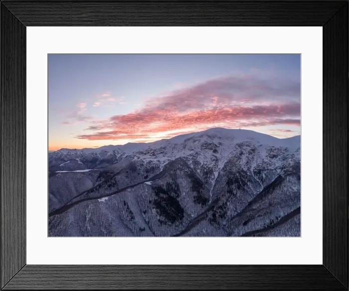 Framed Print : Drone shot of beautifu red sunrise over snow covered frozen mountains Framed Print : Drone shot of beautifu red sunrise over snow covered frozen mountains