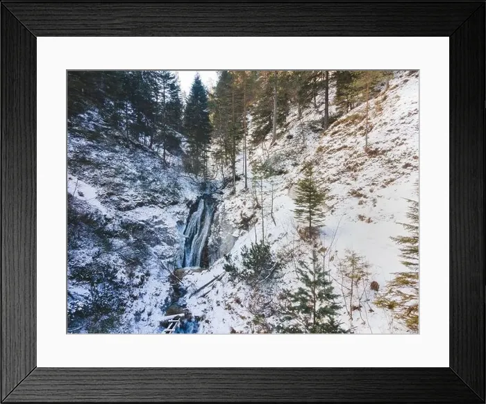 Framed Print : Aerial drone shot of snowy and icy winter landscape in the oetschergraeben Framed Print : Aerial drone shot of snowy and icy winter landscape in the oetschergraeben