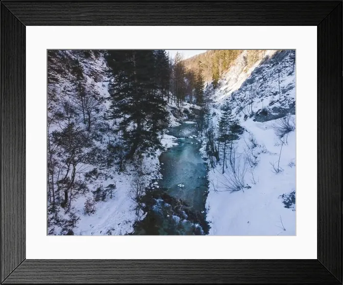 Framed Print : Aerial drone shot of snowy and icy winter landscape in the oetschergraeben Framed Print : Aerial drone shot of snowy and icy winter landscape in the oetschergraeben