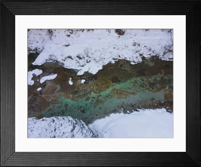 Framed Print : Aerial drone shot of snowy and icy winter landscape in the oetschergraeben Framed Print : Aerial drone shot of snowy and icy winter landscape in the oetschergraeben