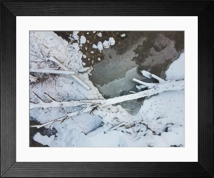 Framed Print : Aerial drone shot of snowy and icy winter landscape in the oetschergraeben Framed Print : Aerial drone shot of snowy and icy winter landscape in the oetschergraeben