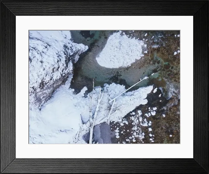 Framed Print : Aerial drone shot of snowy and icy winter landscape in the oetschergraeben Framed Print : Aerial drone shot of snowy and icy winter landscape in the oetschergraeben