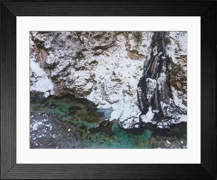 Framed Print : Aerial drone shot of snowy and icy winter landscape in the oetschergraeben Framed Print : Aerial drone shot of snowy and icy winter landscape in the oetschergraeben