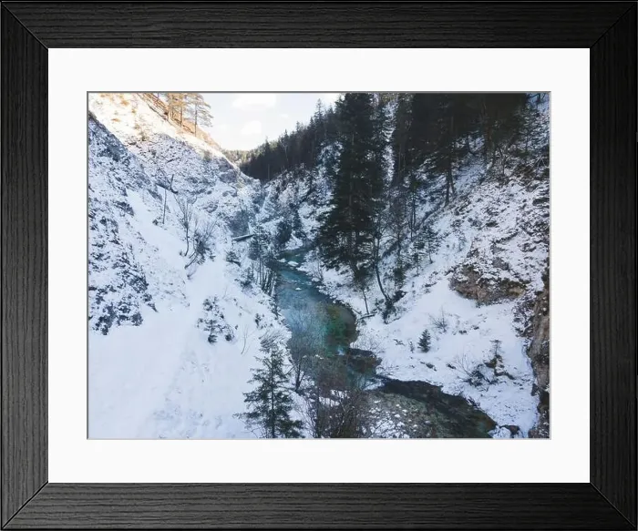 Framed Print : Aerial drone shot of snowy and icy winter landscape in the oetschergraeben Framed Print : Aerial drone shot of snowy and icy winter landscape in the oetschergraeben