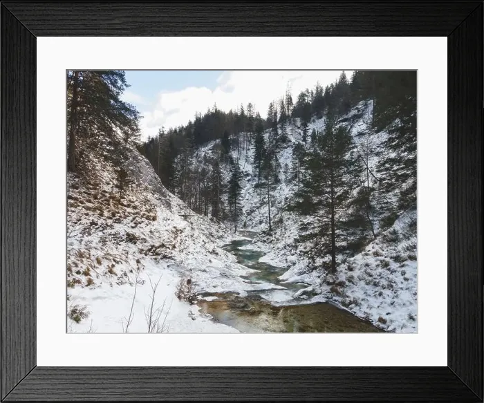 Framed Print : Aerial drone shot of snowy and icy winter landscape in the oetschergraeben Framed Print : Aerial drone shot of snowy and icy winter landscape in the oetschergraeben