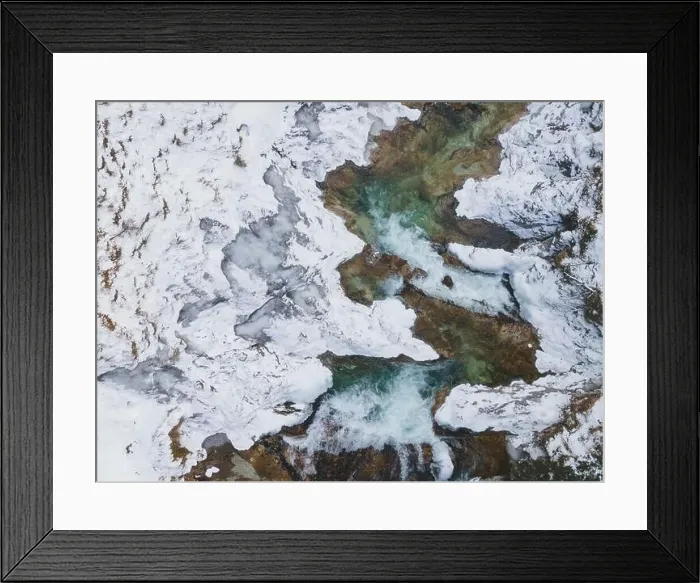 Framed Print : Aerial drone shot of snowy and icy winter landscape in the oetschergraeben Framed Print : Aerial drone shot of snowy and icy winter landscape in the oetschergraeben