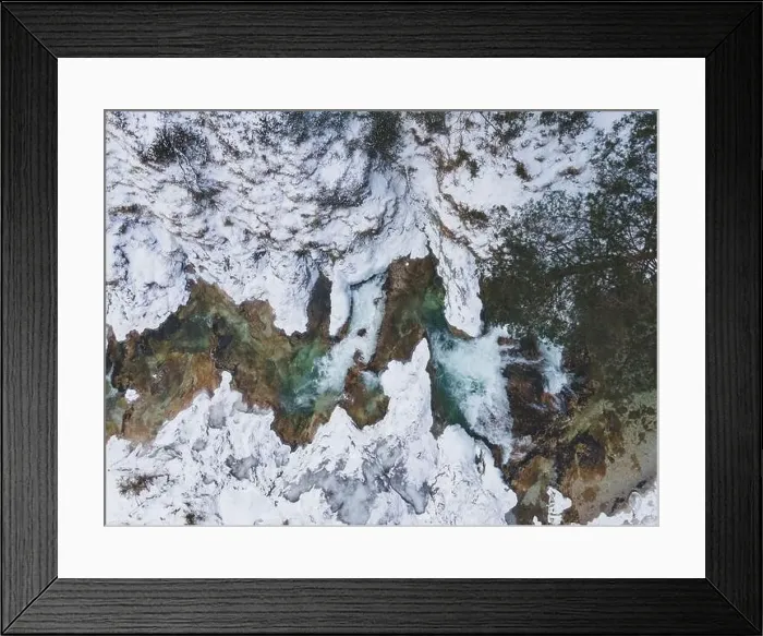 Framed Print : Aerial drone shot of snowy and icy winter landscape in the oetschergraeben Framed Print : Aerial drone shot of snowy and icy winter landscape in the oetschergraeben