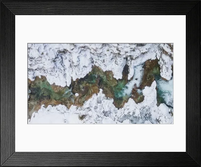 Framed Print : Aerial drone shot of snowy and icy winter landscape in the oetschergraeben Framed Print : Aerial drone shot of snowy and icy winter landscape in the oetschergraeben