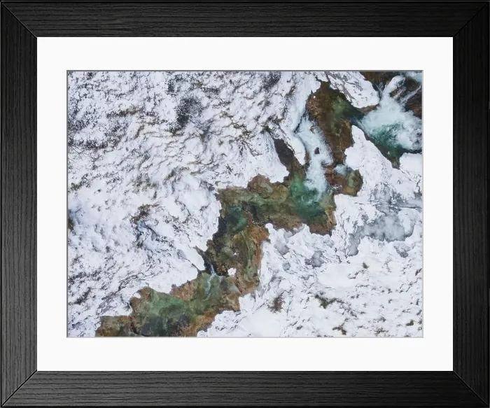 Framed Print : Aerial drone shot of snowy and icy winter landscape in the oetschergraeben Framed Print : Aerial drone shot of snowy and icy winter landscape in the oetschergraeben