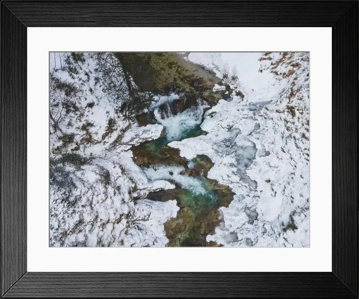 Framed Print : Aerial drone shot of snowy and icy winter landscape in the oetschergraeben Framed Print : Aerial drone shot of snowy and icy winter landscape in the oetschergraeben