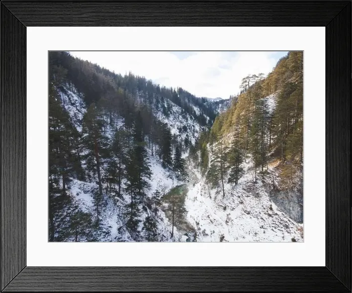 Framed Print : Aerial drone shot of snowy and icy winter landscape in the oetschergraeben Framed Print : Aerial drone shot of snowy and icy winter landscape in the oetschergraeben