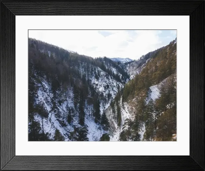 Framed Print : Aerial drone shot of snowy and icy winter landscape in the oetschergraeben Framed Print : Aerial drone shot of snowy and icy winter landscape in the oetschergraeben