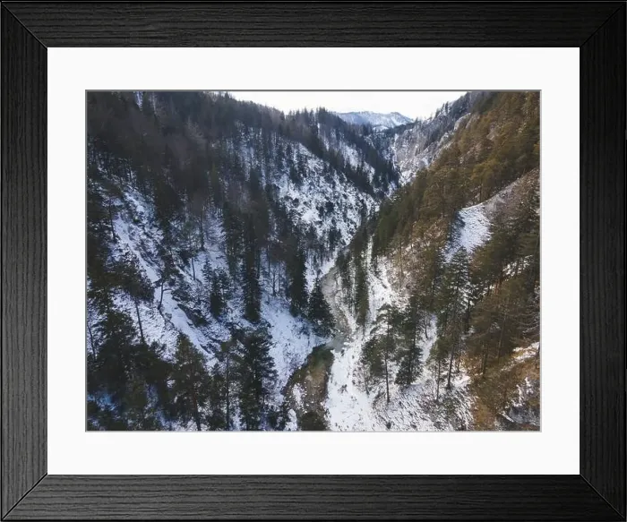 Framed Print : Aerial drone shot of snowy and icy winter landscape in the oetschergraeben Framed Print : Aerial drone shot of snowy and icy winter landscape in the oetschergraeben