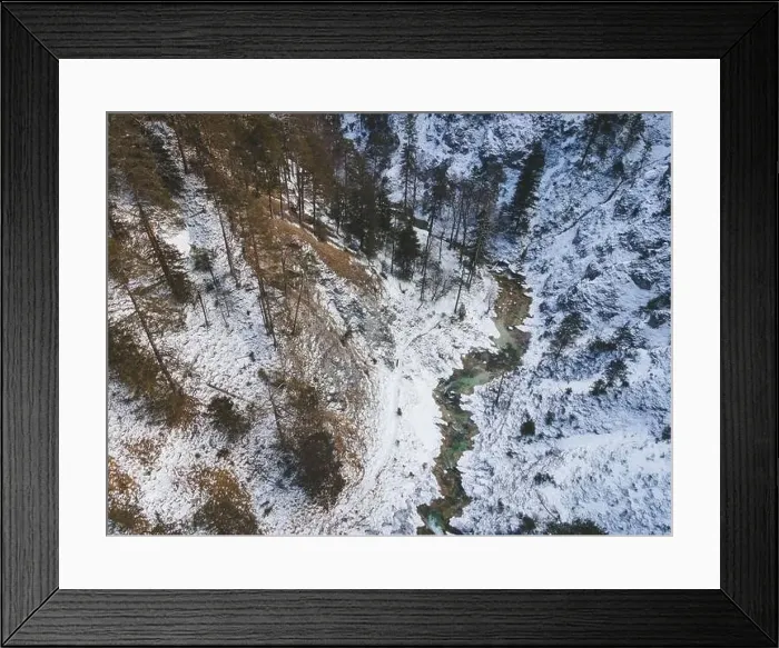 Framed Print : Aerial drone shot of snowy and icy winter landscape in the oetschergraeben Framed Print : Aerial drone shot of snowy and icy winter landscape in the oetschergraeben
