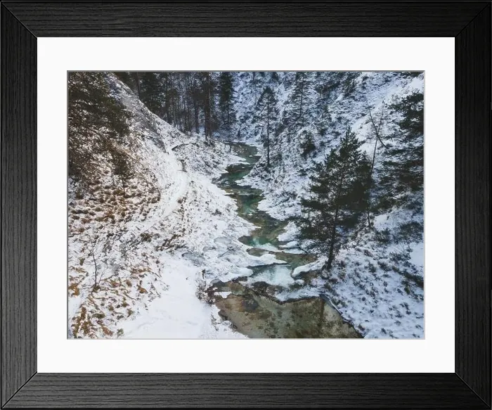 Framed Print : Aerial drone shot of snowy and icy winter landscape in the oetschergraeben Framed Print : Aerial drone shot of snowy and icy winter landscape in the oetschergraeben