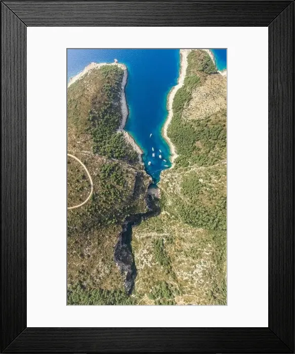 Framed Print : Aerial overhead drone shot of Stiniva covert cove beach in Adriatic sea on Vis Island in Croatia in summer Framed Print : Aerial overhead drone shot of Stiniva covert cove beach in Adriatic sea on Vis Island in Croatia in summer