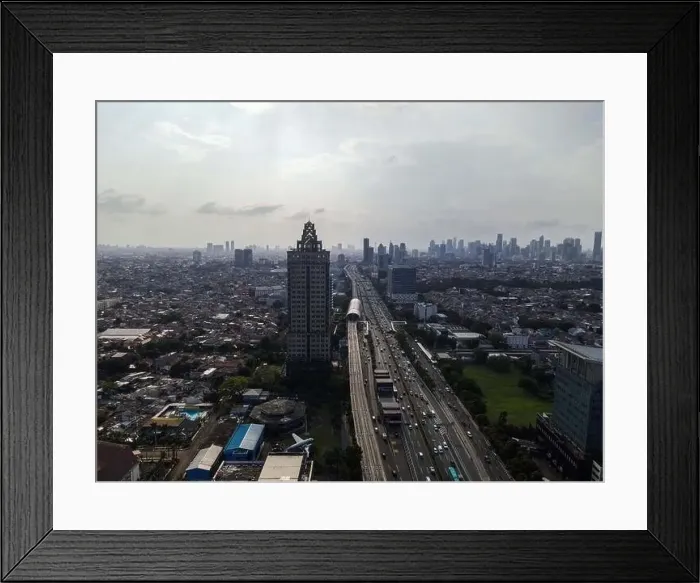 Framed Print : Aerial view of highway intersection and buildings in the city of Jakarta and noise cloud with Jakarta cityscape Framed Print : Aerial view of highway intersection and buildings in the city of Jakarta and noise cloud with Jakarta cityscape