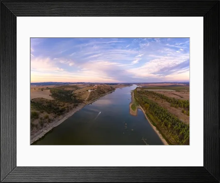 Framed Print : Juromenha castle, village and boat in Guadiana river drone aerial view at sunset in Alentejo, Portugal Framed Print : Juromenha castle, village and boat in Guadiana river drone aerial view at sunset in Alentejo, Portugal