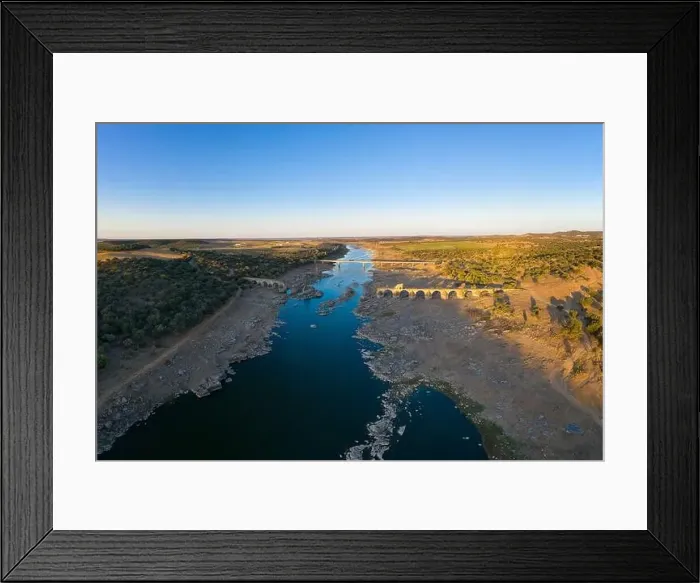 Framed Print : Destroyed abandoned Ajuda bridge drone aerial view, crossing the Guadiana river between Spain and Portugal Framed Print : Destroyed abandoned Ajuda bridge drone aerial view, crossing the Guadiana river between Spain and Portugal