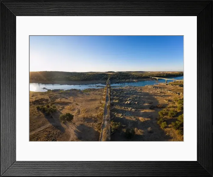 Framed Print : Destroyed abandoned Ajuda bridge drone aerial view, crossing the Guadiana river between Spain and Portugal Framed Print : Destroyed abandoned Ajuda bridge drone aerial view, crossing the Guadiana river between Spain and Portugal