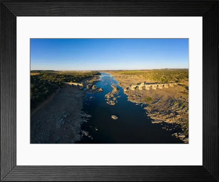 Framed Print : Destroyed abandoned Ajuda bridge drone aerial view, crossing the Guadiana river between Spain and Portugal Framed Print : Destroyed abandoned Ajuda bridge drone aerial view, crossing the Guadiana river between Spain and Portugal