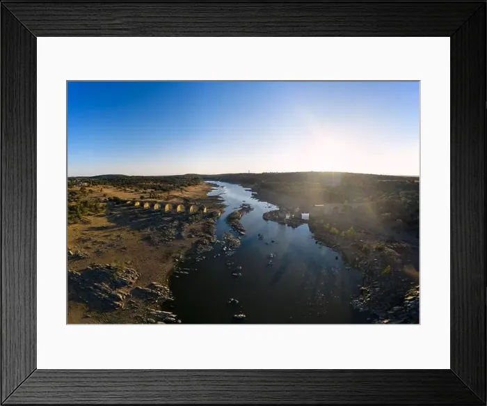 Framed Print : Destroyed abandoned Ajuda bridge drone aerial view, crossing the Guadiana river between Spain and Portugal Framed Print : Destroyed abandoned Ajuda bridge drone aerial view, crossing the Guadiana river between Spain and Portugal