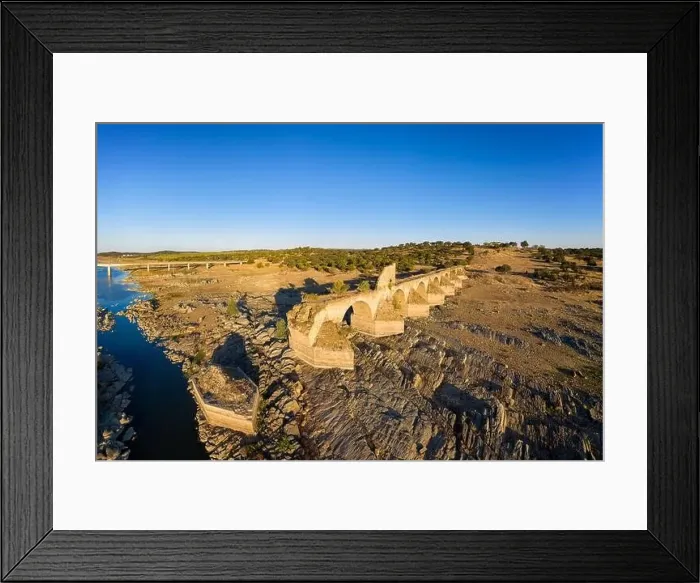 Framed Print : Destroyed abandoned Ajuda bridge drone aerial view, crossing the Guadiana river between Spain and Portugal Framed Print : Destroyed abandoned Ajuda bridge drone aerial view, crossing the Guadiana river between Spain and Portugal