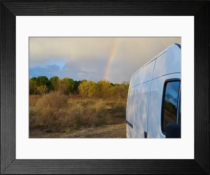 Framed Print : Camper van living vanlife on nature landscape with a rainbow behind it at sunset, in Portugal Framed Print : Camper van living vanlife on nature landscape with a rainbow behind it at sunset, in Portugal