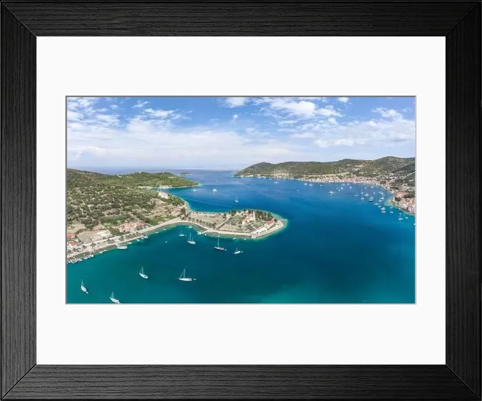 Framed Print : Aerial drone shot of Vis Island port with St. Jeronima church and Adriatic coastline in summer Framed Print : Aerial drone shot of Vis Island port with St. Jeronima church and Adriatic coastline in summer