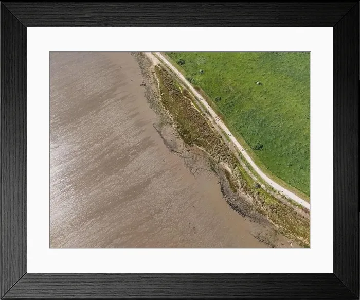 Framed Print : Aerial view of a small walkway path along Tagus river in Lisbon, Portugal Framed Print : Aerial view of a small walkway path along Tagus river in Lisbon, Portugal