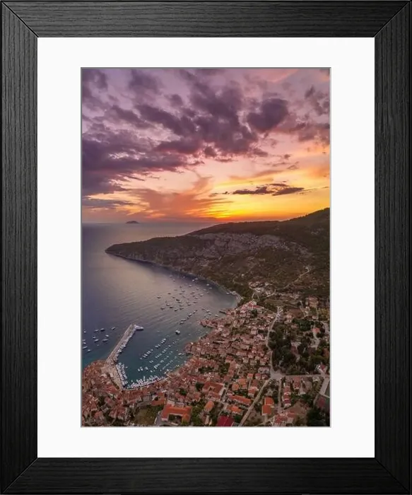 Framed Print : Aerial drone shot of sunset burning sky clouds on Komiza town over Vis Island in Croatia Summer Framed Print : Aerial drone shot of sunset burning sky clouds on Komiza town over Vis Island in Croatia Summer