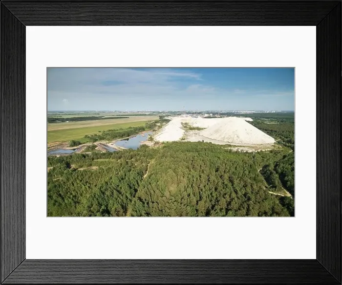 Framed Print : Poison lake with solid waste mountain aerial drone view