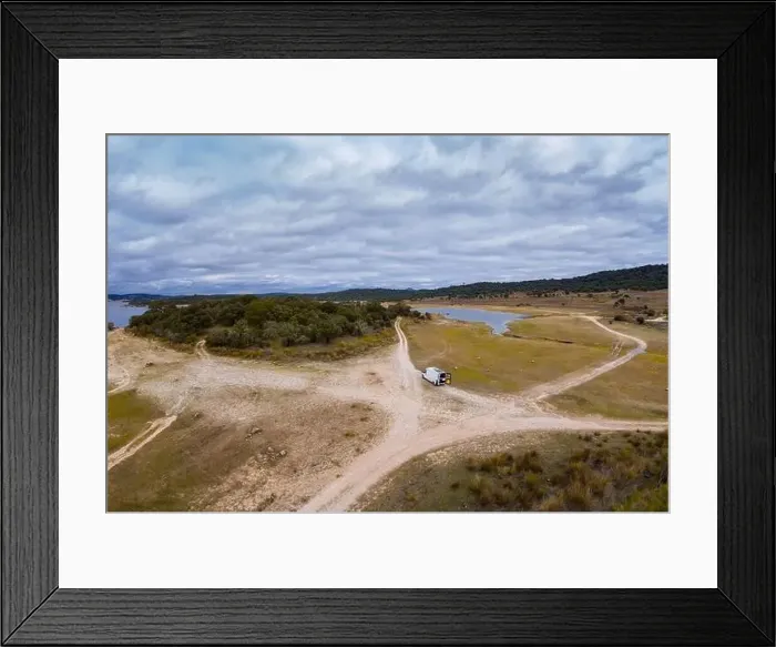 Framed Print : Lake drone aerial view of a camper van with solar panel living van life mountain panorama landscape at sunset in Idanha Framed Print : Lake drone aerial view of a camper van with solar panel living van life mountain panorama landscape at sunset in Idanha