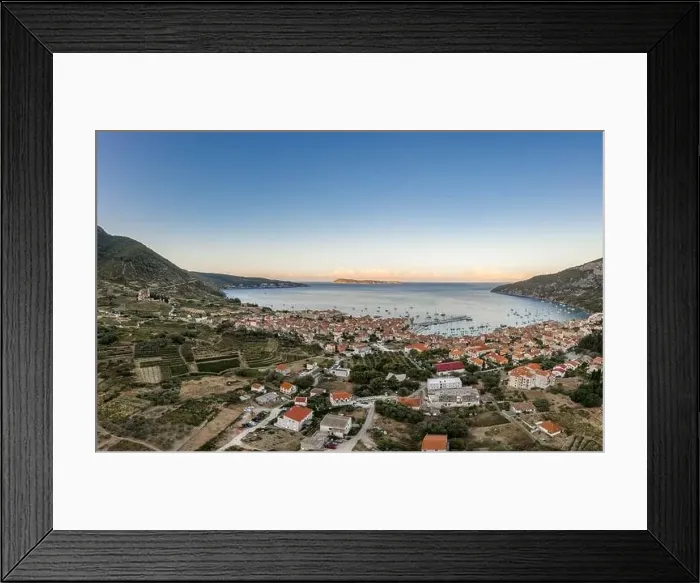 Framed Print : Aerial drone shot of adriatic sea Komiza town on Vis Island with view of Bisevo Island in Croatia summer sunrise Framed Print : Aerial drone shot of adriatic sea Komiza town on Vis Island with view of Bisevo Island in Croatia summer sunrise