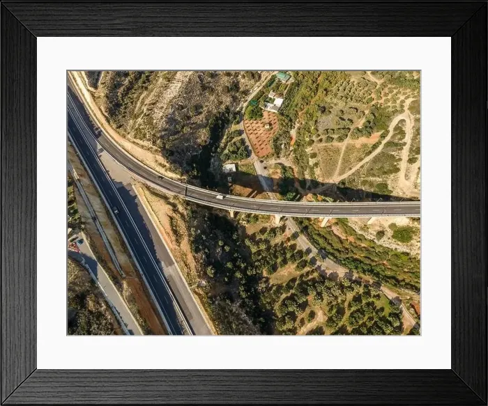 Framed Print : Aerial top view by drone of landscape with asphalt road Framed Print : Aerial top view by drone of landscape with asphalt road
