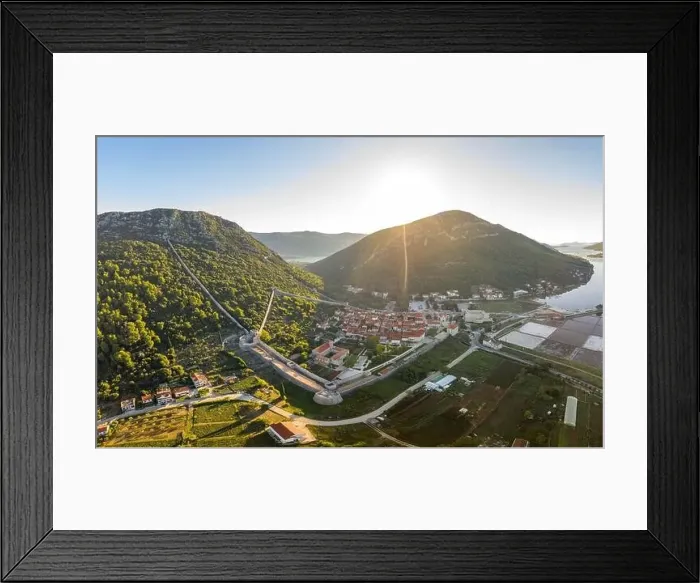 Framed Print : Aerial drone shot of Ston city wall over hill in Ragusa region near Dubrovnik in Croatia summer sunrise