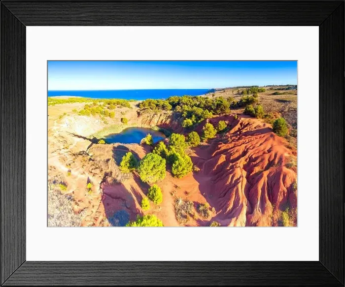 Framed Print : Red rocks of the bauxite quarry abandoned mine and lake, aerial view, Otranto, Lecce province, Apulia, Italy Framed Print : Red rocks of the bauxite quarry abandoned mine and lake, aerial view, Otranto, Lecce province, Apulia, Italy