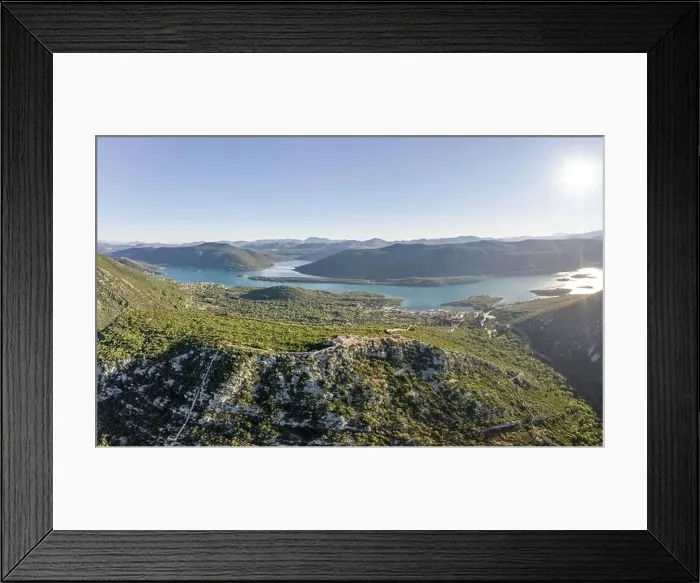 Framed Print : Aerial drone shot of City Wall of Ston over hill to Mali Ston in Croatia summer morning sunrise Framed Print : Aerial drone shot of City Wall of Ston over hill to Mali Ston in Croatia summer morning sunrise